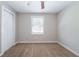 Neutral bedroom with a ceiling fan, carpet, and a window providing natural light at 10150 Puckett St, Covington, GA 30014