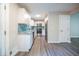 Bright kitchen with stainless steel appliances, granite countertops, a blue backsplash, and modern cabinetry at 10150 Puckett St, Covington, GA 30014