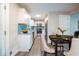 Bright kitchen with stainless steel appliances, granite countertops, a blue backsplash, and modern cabinetry at 10150 Puckett St, Covington, GA 30014