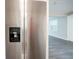 Close up of a stainless steel refrigerator with water and ice dispenser in a modern kitchen at 10150 Puckett St, Covington, GA 30014