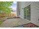 Back patio with sliding glass doors, a concrete patio, and planting beds at 161 Stoneforest Dr, Woodstock, GA 30189