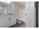 Bathroom featuring granite vanity, modern fixtures, bathtub, shower, and toilet at 161 Stoneforest Dr, Woodstock, GA 30189