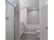 Bathroom featuring granite vanity, modern fixtures, bathtub, shower, and toilet at 161 Stoneforest Dr, Woodstock, GA 30189