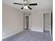 Bedroom with fan and access to closet at 161 Stoneforest Dr, Woodstock, GA 30189