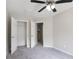 Bedroom with gray carpet, neutral walls, and a closet and open doorway at 161 Stoneforest Dr, Woodstock, GA 30189