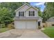 Charming two-story home featuring a two-car garage and well-maintained landscaping in a desirable location at 161 Stoneforest Dr, Woodstock, GA 30189