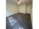 Spacious carpeted bedroom with two closet doors and a ceiling fan at 101 Dancing Fox Rd, Decatur, GA 30032