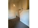 Carpeted upstairs hallway with a modern pendant light at 101 Dancing Fox Rd, Decatur, GA 30032
