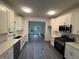 Modern kitchen featuring white cabinets, quartz countertops, and stainless steel appliances at 101 Dancing Fox Rd, Decatur, GA 30032