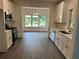 Bright modern kitchen with stainless appliances and hardwood flooring at 101 Dancing Fox Rd, Decatur, GA 30032