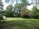 Spacious backyard with lush lawn and mature trees at 1253 Gatewood Drive Dr, Lawrenceville, GA 30043