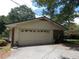 Detached two-car garage with brick accents and adjacent driveway at 1253 Gatewood Drive Dr, Lawrenceville, GA 30043