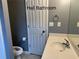 Functional hall bathroom features a toilet, a sink with vanity, and neutral-toned walls at 169 Rachel Blvd, Temple, GA 30179