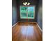 Sunny breakfast room features hardwood flooring and a large window with views of the yard at 169 Rachel Blvd, Temple, GA 30179