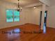 Spacious dining room with hardwood floors, chandelier, and bright natural light at 169 Rachel Blvd, Temple, GA 30179