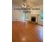 Spacious living room boasts gleaming hardwood floors and a stunning vaulted ceiling with a ceiling fan at 169 Rachel Blvd, Temple, GA 30179