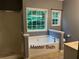 Modern Primary bath featuring a soaking tub, separate shower, and plenty of natural light at 169 Rachel Blvd, Temple, GA 30179