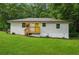 Charming painted brick home with a bright yellow front door and inviting front porch at 4443 Flat Shoals Pkwy, Decatur, GA 30034