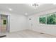 Bright and airy living room featuring new flooring and ample natural light through the window at 4443 Flat Shoals Pkwy, Decatur, GA 30034