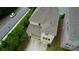 Aerial view of a well-maintained home highlighting the roof, brick exterior, and driveway at 4895 Sterling Close, Buford, GA 30518