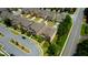 Aerial view of a neighborhood featuring well-maintained homes, green landscaping, and orderly street layout at 4895 Sterling Close, Buford, GA 30518
