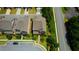 Aerial shot shows neighborhood and features manicured lawns and houses with green trees at 4895 Sterling Close, Buford, GA 30518