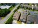 Aerial view of townhomes near a street, buildings, and ample parking spaces at 4895 Sterling Close, Buford, GA 30518
