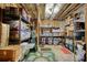 Unfinished basement with exposed beams, storage shelving and flooring at 4895 Sterling Close, Buford, GA 30518