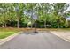Private blacktop basketball practice court in a residential neighborhood has a goal and backboard ready for action at 4895 Sterling Close, Buford, GA 30518