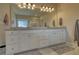 Large bathroom vanity with double sinks and white cabinets, towels, and grey rugs at 4895 Sterling Close, Buford, GA 30518