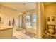 Bright bathroom featuring a tub, shower, and vanity area, perfect for relaxation and convenience at 4895 Sterling Close, Buford, GA 30518