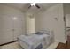 Bedroom with a white framed bed, dark floors, and white doors at 4895 Sterling Close, Buford, GA 30518
