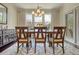 Dining room with natural light, wood floors, and traditional style furniture at 4895 Sterling Close, Buford, GA 30518
