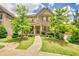 Beautiful two-story home with stone accents, mature landscaping, and inviting porch at 4895 Sterling Close, Buford, GA 30518