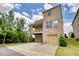 Well-maintained two-story home with a brick exterior, a covered patio, and a two-car garage at 4895 Sterling Close, Buford, GA 30518