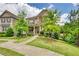 Two-story home with landscaped front yard, walkway and a cozy covered front porch at 4895 Sterling Close, Buford, GA 30518