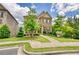Attractive two-story home with well-manicured lawn and inviting front porch seating at 4895 Sterling Close, Buford, GA 30518