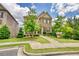 Charming two-story home with a stone and siding facade, beautiful landscaping and a welcoming front porch at 4895 Sterling Close, Buford, GA 30518