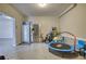 Garage area equipped with a refrigerator and various toys at 4895 Sterling Close, Buford, GA 30518