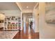 Hallway with hardwood floors and decorative shelving for toys and books at 4895 Sterling Close, Buford, GA 30518