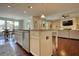 Open-concept kitchen featuring a central island, stainless steel appliances, and hardwood floors at 4895 Sterling Close, Buford, GA 30518