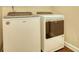 Modern laundry room with a white front-load washer and dryer set for convenient laundry care at 4895 Sterling Close, Buford, GA 30518