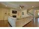 Spacious living room with fireplace, built-in shelving, and hardwood floors at 4895 Sterling Close, Buford, GA 30518