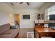 Spacious living room with hardwood floors, ample lighting, and a view of the stairs at 4895 Sterling Close, Buford, GA 30518