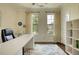 Well-lit office featuring a large desk, bookshelves, and large windows at 4895 Sterling Close, Buford, GA 30518