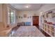 Spacious playroom with hardwood floors, a large window, and ample storage for toys and books at 4895 Sterling Close, Buford, GA 30518