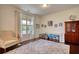 Bright playroom features a large window, neutral walls, hardwood flooring, and stylish decor at 4895 Sterling Close, Buford, GA 30518