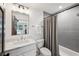 Bathroom featuring marble countertops, large vanity, toilet, and tiled shower with a curtain at 6175 Weatherly Dr, Sandy Springs, GA 30328