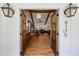 Inviting entryway with wood double doors, hardwood floors, and view of the living room at 6175 Weatherly Dr, Sandy Springs, GA 30328