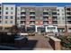 Stylish building facade with retail shops and apartments at 6175 Weatherly Dr, Sandy Springs, GA 30328